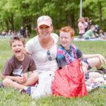 Mother and 2 sons Family Day Picnic on the Lawn