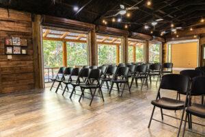 garage doors open with theater seating at The Summit Meeting Facility at Deer Run Camps & Retreats
