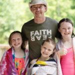 single dad and 3 daughters at Deer Run Summer Family Camp
