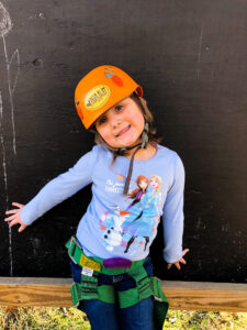 girl in orange helmet at Deer Run Winter Day Camp