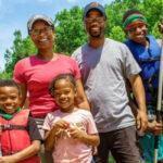 parents with 3 kids at cardboard regatta at family camp at deer run camps & retreats