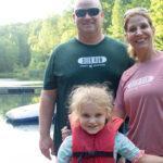 parents with daughter at spring valley lake attending Family Camp at Deer Run Camps & Retreats