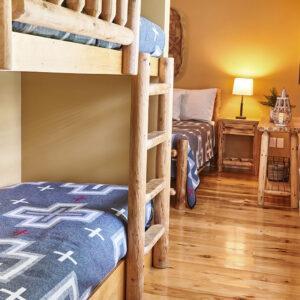 queen bed and bunks in Mountain Dreams at The Lodge at Deer Run
