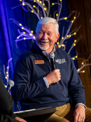 CEO and founder of Deer Run Camps & Retreats, David Gibson, smiling while speaking to attendants of Vision Dinner 2023 event.