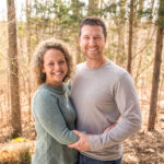 Wife and Husband smiling at Deer Run Camps & Retreats Springtime Married Couples Weekend.