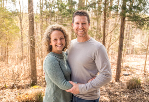 Wife and Husband smiling at Deer Run Camps & Retreats Springtime Married Couples Weekend.