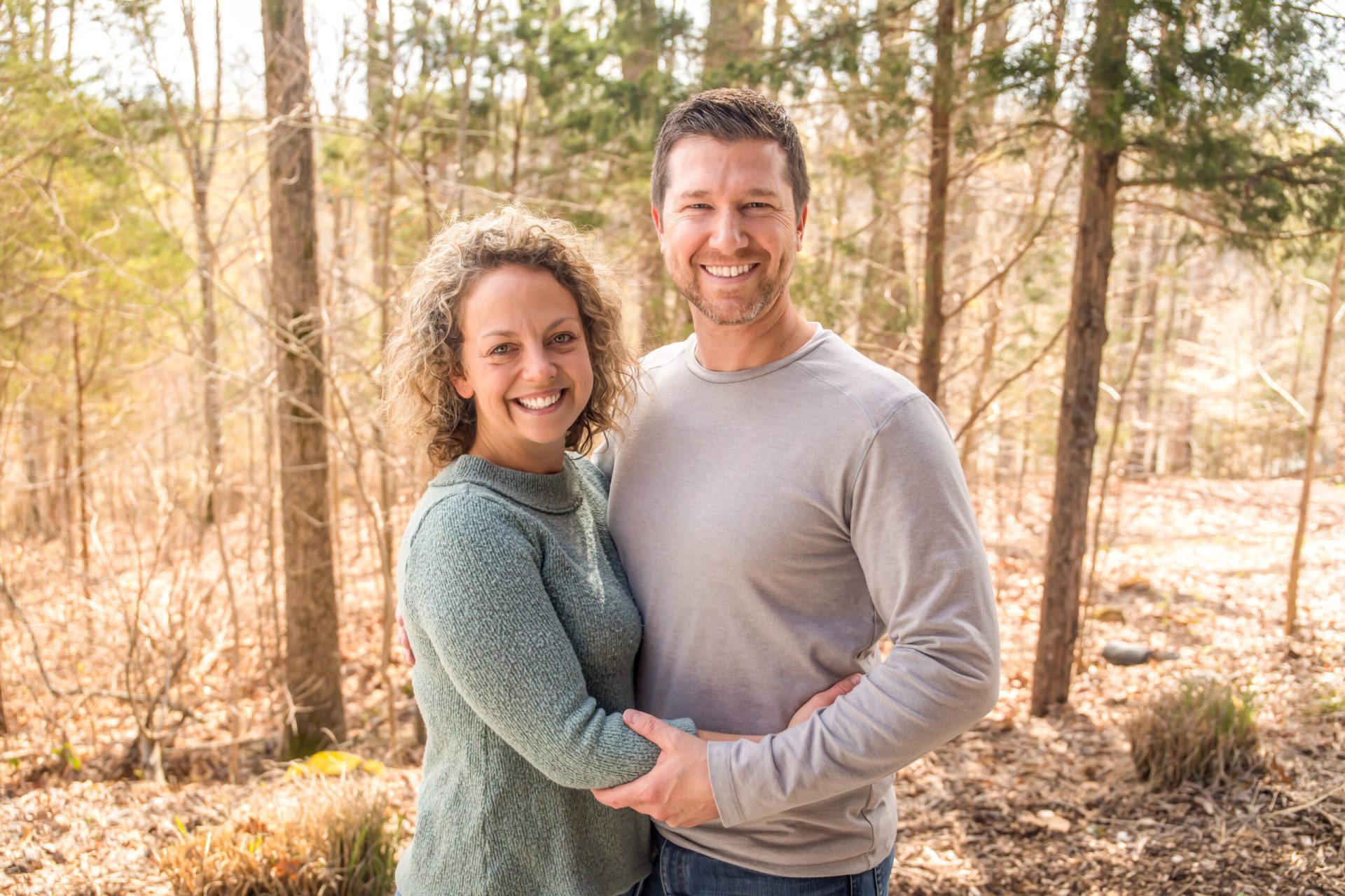 Wife and Husband smiling at Deer Run Camps & Retreats Springtime Married Couples Weekend.