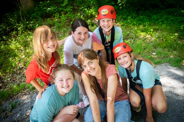 Camp Counselor and Campers at summer camp smiling