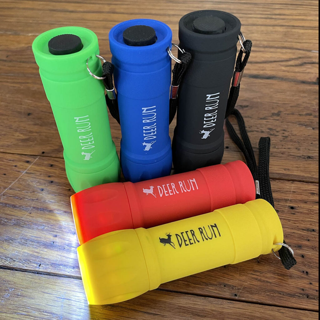 5 color options Deer Run Rubber Mini Flashlight available for purchase at The Camp Store