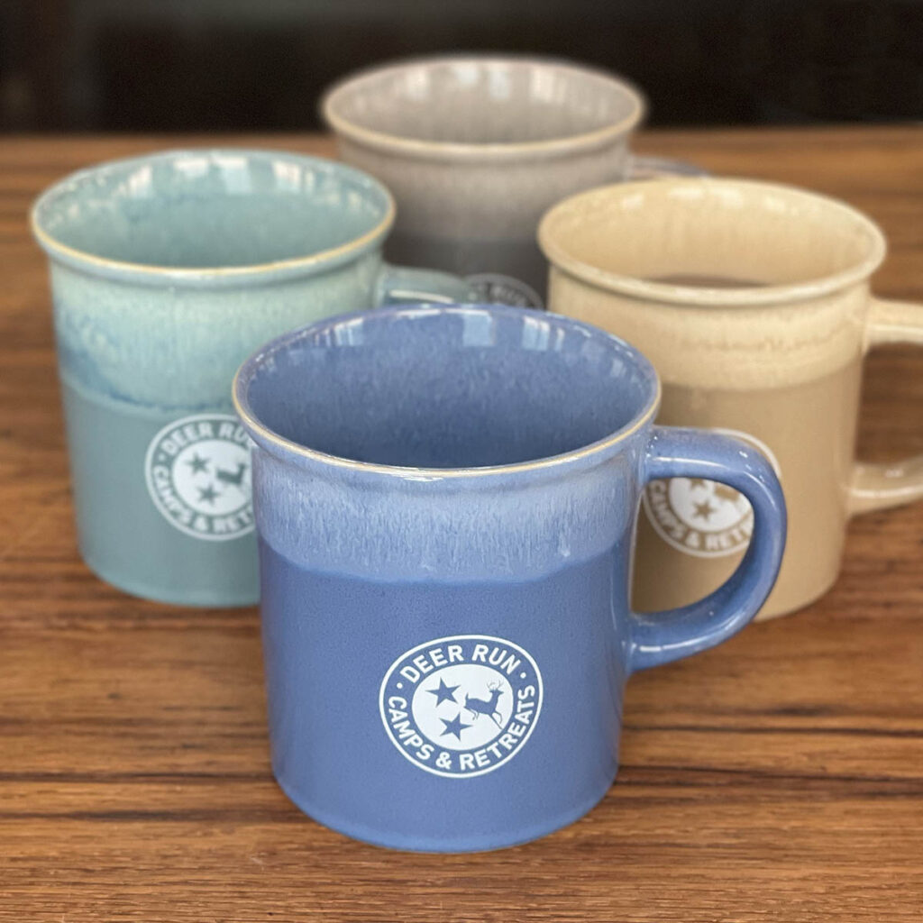 4 color options Deer Run TriStar Ceramic Mugs available for purchase at The Camp Store